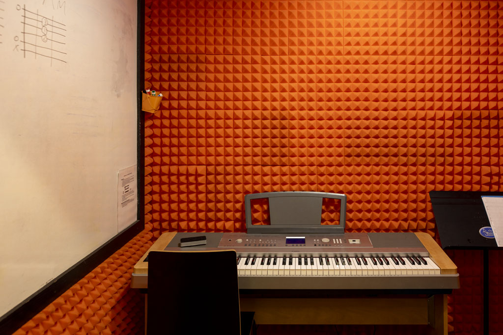 Keyboard and whiteboard setup in private teaching space at St John Music Lessons